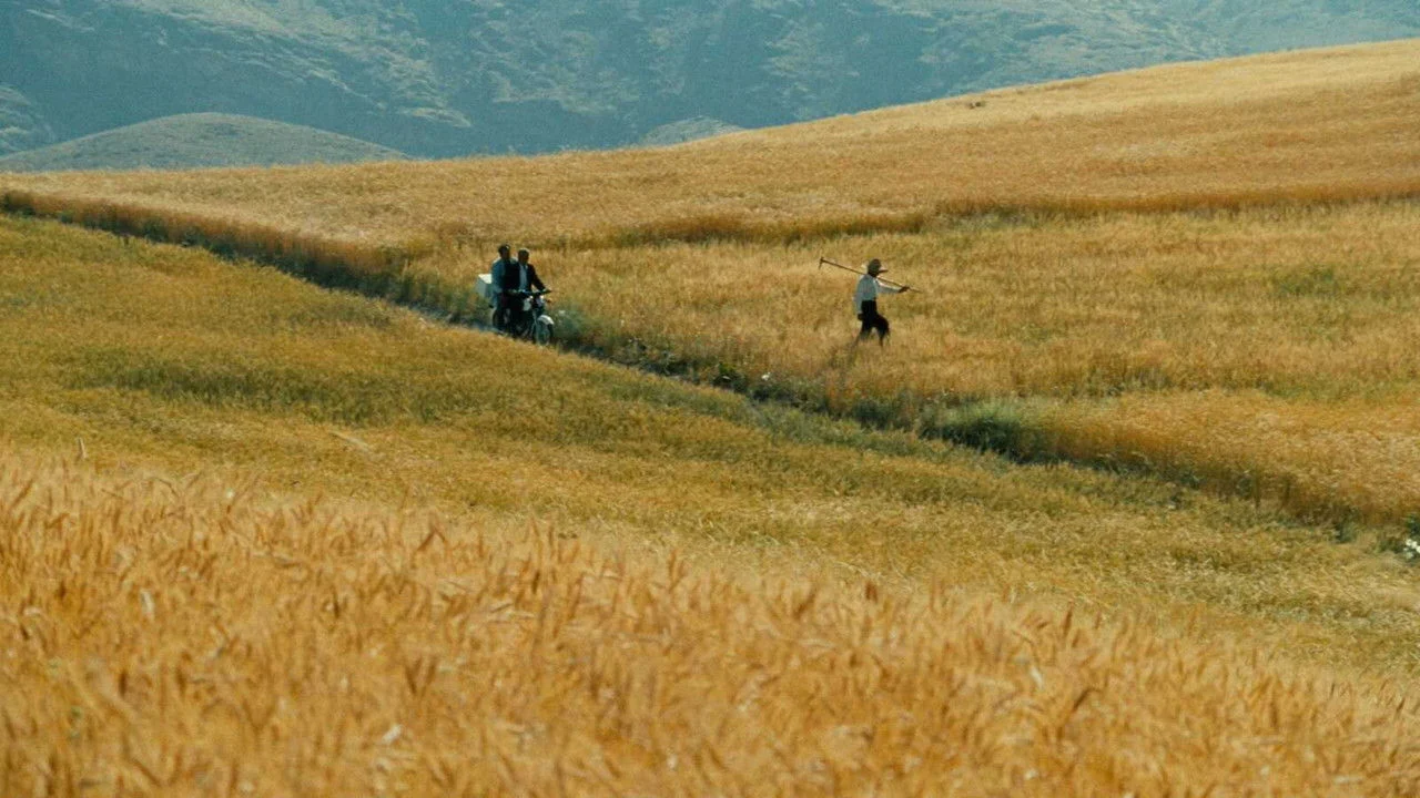 The Wind Will Carry Us backdrop