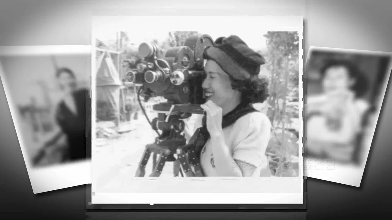Women with a camera backdrop