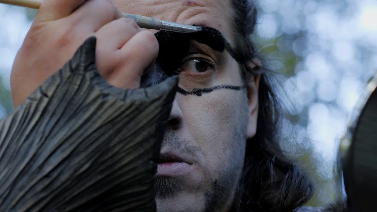 De spelende mens backdrop