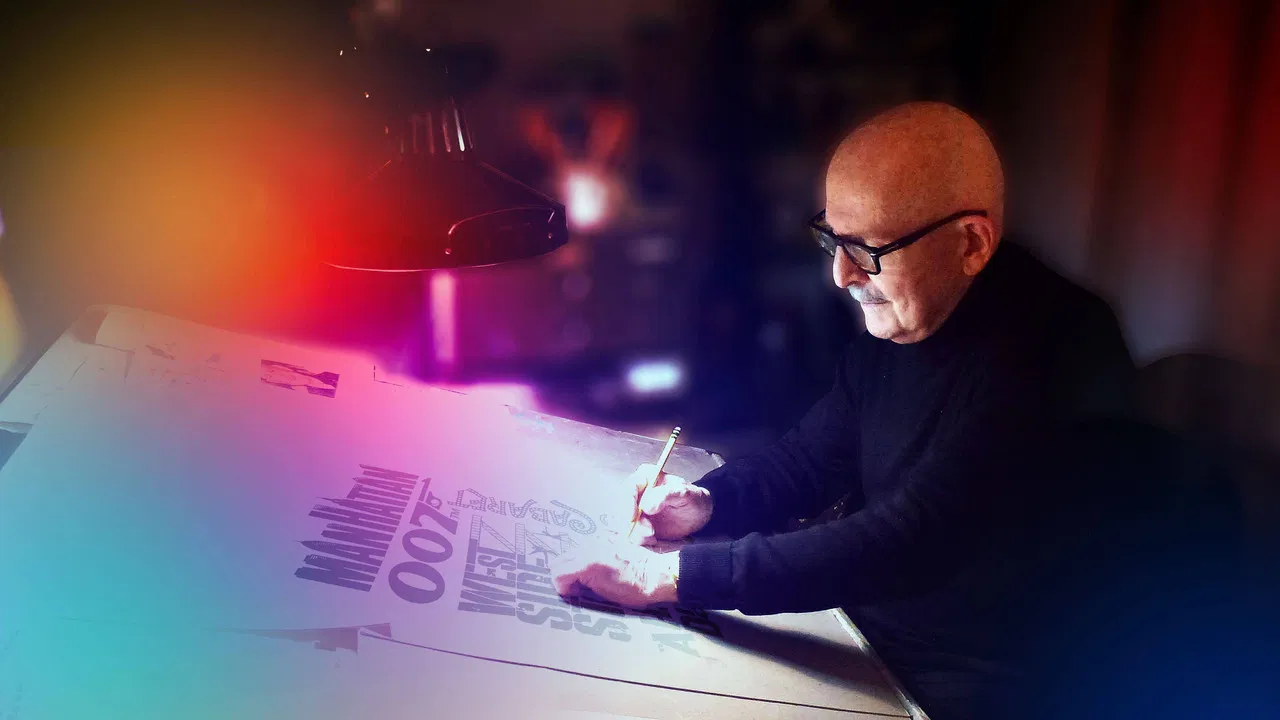 By Design: The Joe Caroff Story backdrop