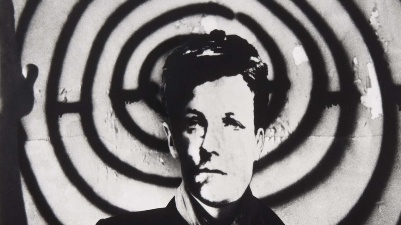 Arthur Rimbaud in New York backdrop
