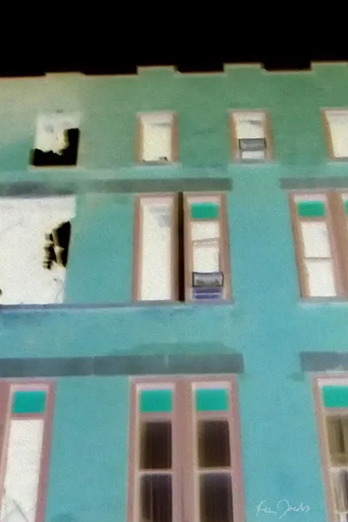 Brick Building with Red and Green Windows poster