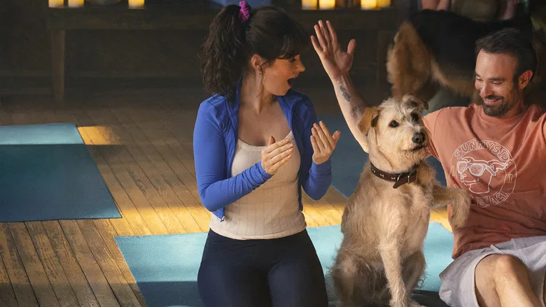 Merv looking depressed on the beach while Anna and Russ talk in the background