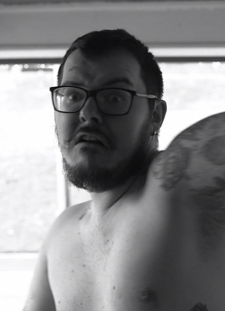 Naked Man with a Hammer poster background