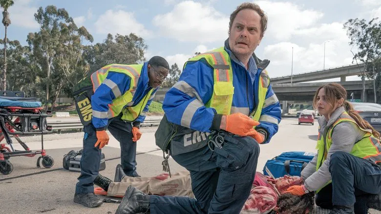 Rainn Wilson as Randy looking exhausted in the ambulance